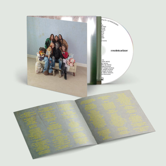 Wet Leg 'moisturizer (deluxe)' CD with cover featuring a family photo.